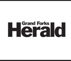 Logo of the Grand Forks Herald, depicted with the publication's name in bold, black font on a white background.