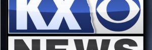Logo of KX News, a CBS-affiliated television station, featuring the slogan "PUTTING NORTH DAKOTA FIRST.
