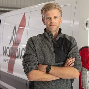 Lars of Nordic Inspections in front of white van bearing the logo and text "Nordic Inspections.