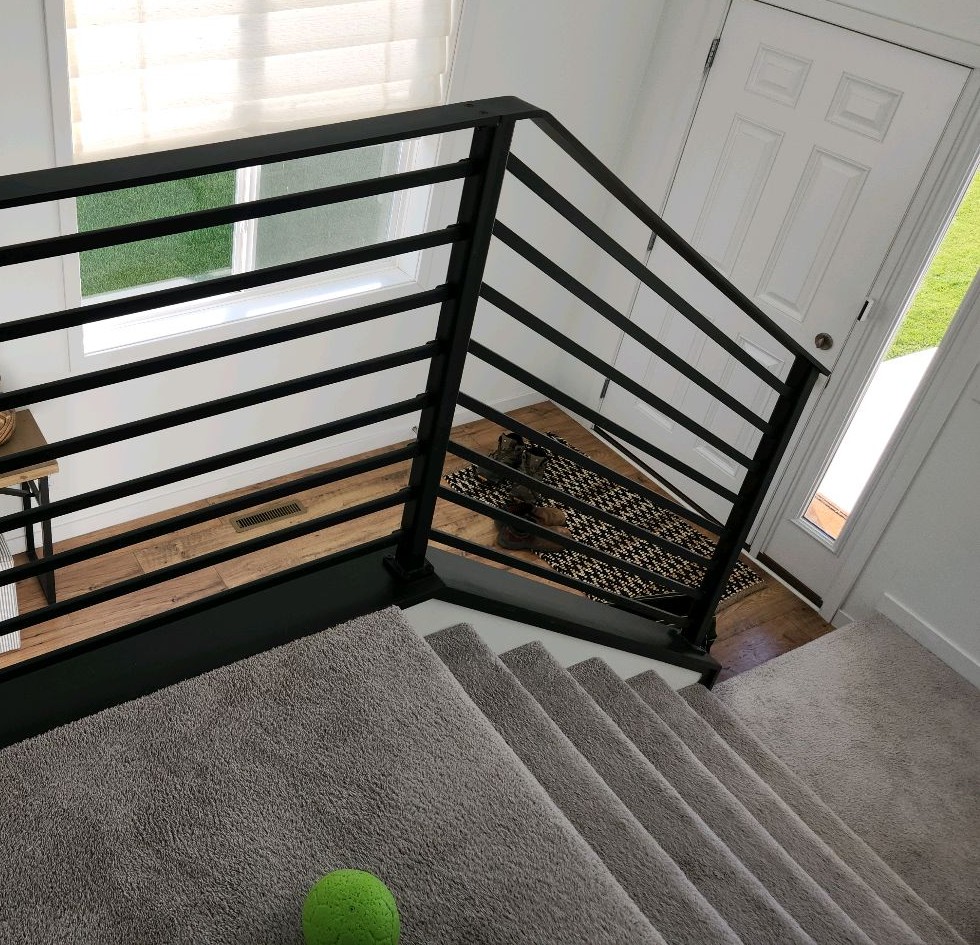 Stairway guardrail with horizontal bars that a child could climb