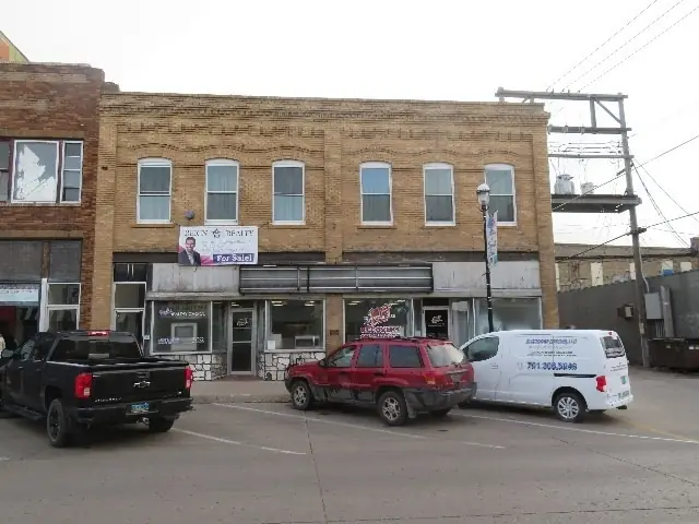 A multi-story historic building with street-level storefronts — commercial building inspected by Nordic Inspections in Devils Lake, ND.