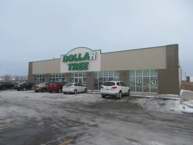 A retail store building with a front entrance canopy — commercial building inspected by Nordic Inspections in Dilworth, MN.