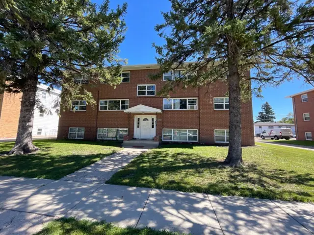 A walk-up apartment building with a shared entrance — commercial building inspected by Nordic Inspections in Fargo, ND.
