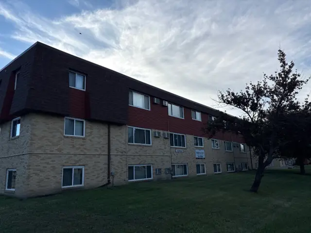 A multi-story brick apartment building, a commercial building inspected by Nordic Inspections in Fargo, ND.