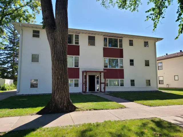 A walk-up apartment building with a shared entrance, a commercial building inspected by Nordic Inspections in Fargo, ND.