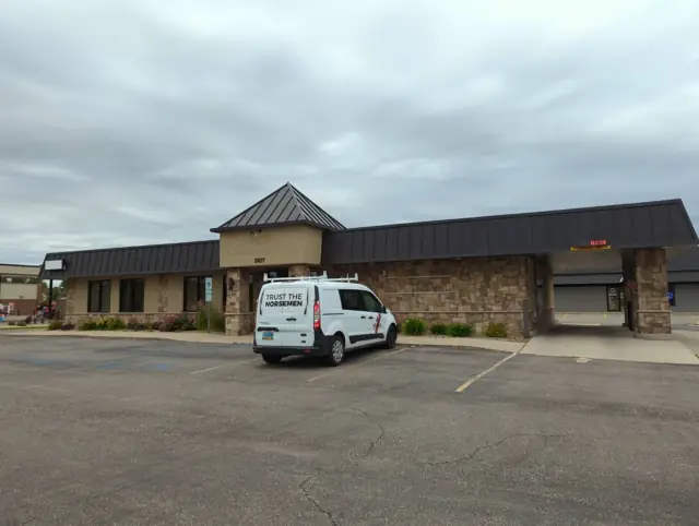 A bank building with a drive-thru canopy, a commercial building inspected by Nordic Inspections in Fargo, ND.