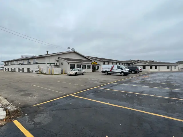 A long commercial complex with multiple units, a commercial building inspected by Nordic Inspections in Fargo, ND.