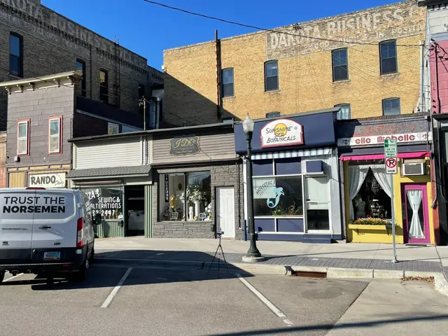 A multi-story historic building with street-level storefronts — commercial building inspected by Nordic Inspections in Fargo, ND.