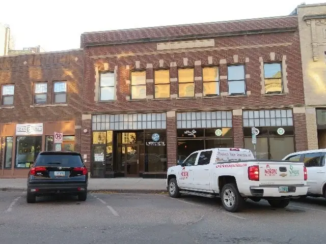 A multi-story historic building with street-level storefronts, a commercial building inspected by Nordic Inspections in Fargo, ND.