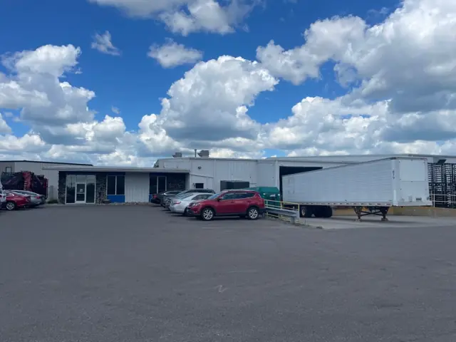 An industrial facility with a wide paved yard, a commercial building inspected by Nordic Inspections in Fargo, ND.