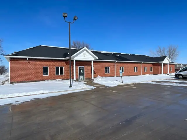 An office building with a landscaped entrance — commercial building inspected by Nordic Inspections in Fargo, ND.