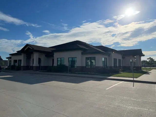 An office building with a landscaped entrance, a commercial building inspected by Nordic Inspections in Fargo, ND.