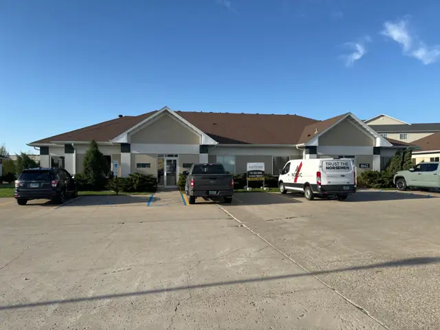 A single-story office building with a front parking lot, a commercial building inspected by Nordic Inspections in Fargo, ND.