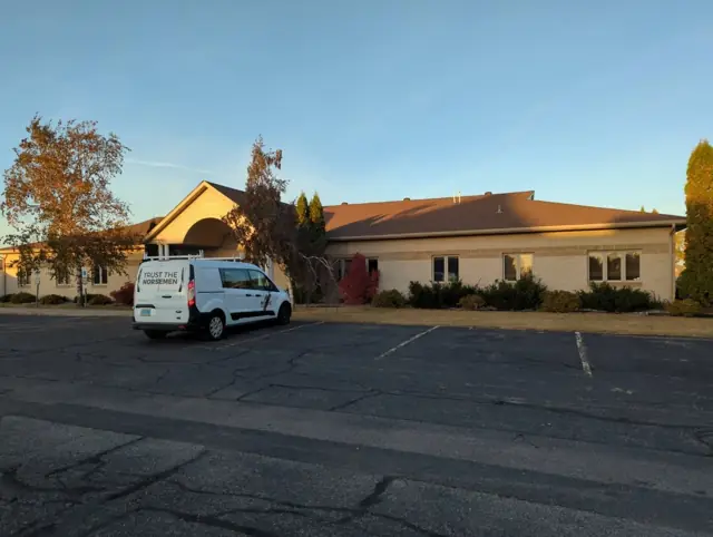 An office building with a landscaped entrance — commercial building inspected by Nordic Inspections in Fargo, ND.