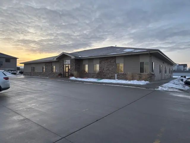A single-story office building with a front parking lot, a commercial building inspected by Nordic Inspections in Fargo, ND.