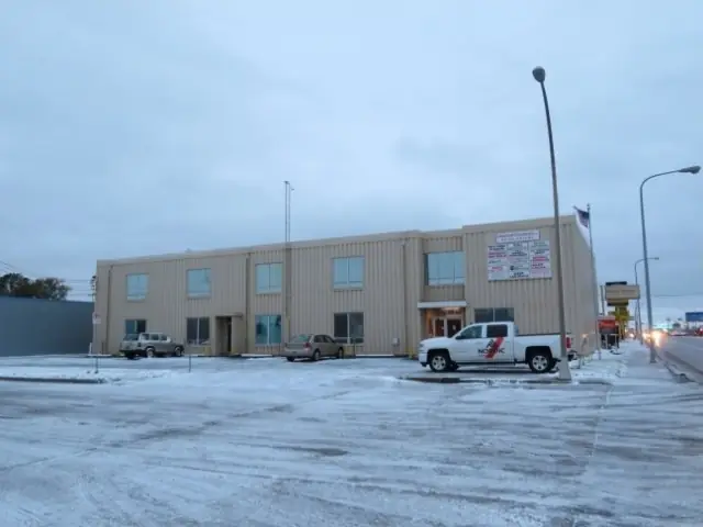 A single-story office building with a front parking lot, a commercial building inspected by Nordic Inspections in Fargo, ND.
