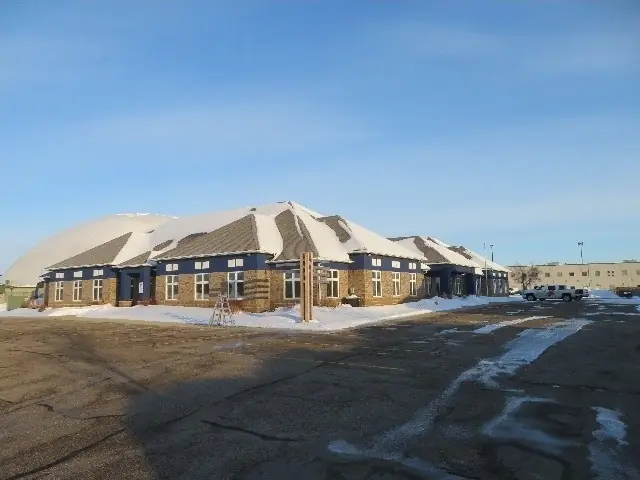 A single-story office building with a front parking lot — commercial building inspected by Nordic Inspections in Fargo, ND.