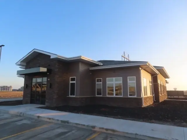 An office building with a landscaped entrance — commercial building inspected by Nordic Inspections in Fargo, ND.