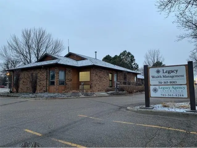 An office building with a landscaped entrance — commercial building inspected by Nordic Inspections in Fargo, ND.