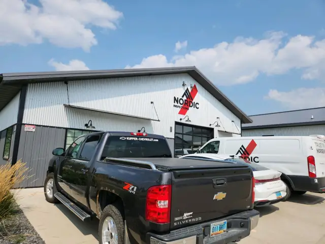 An office/warehouse with a paved lot, a commercial building inspected by Nordic Inspections in Fargo, ND.