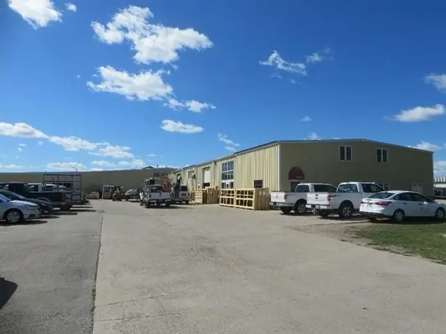 An office/warehouse building with overhead doors, a commercial building inspected by Nordic Inspections in Fargo, ND.