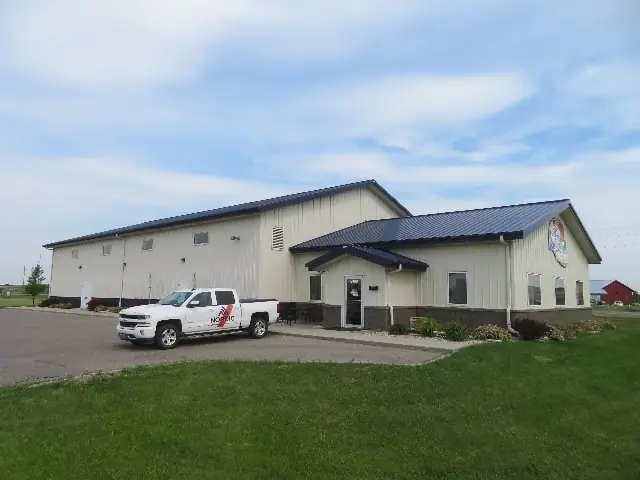An office/warehouse building with overhead doors, a commercial building inspected by Nordic Inspections in Fargo, ND.