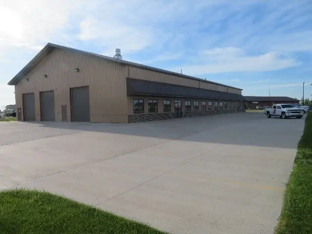 An office/warehouse building with overhead doors, a commercial building inspected by Nordic Inspections in Fargo, ND.