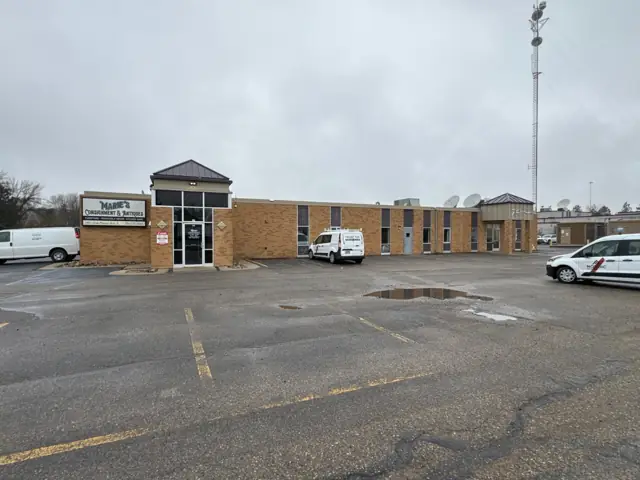 An office/warehouse with a paved lot — commercial building inspected by Nordic Inspections in Fargo, ND.