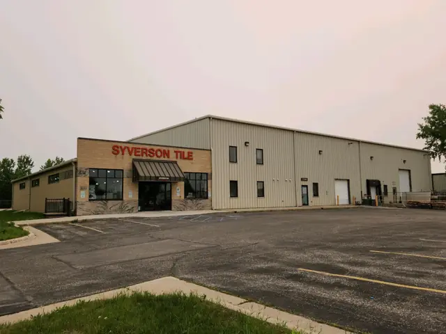 An office/warehouse building with overhead doors — commercial building inspected by Nordic Inspections in Fargo, ND.