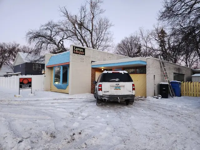 A small retail building with display windows — commercial building inspected by Nordic Inspections in Fargo, ND.