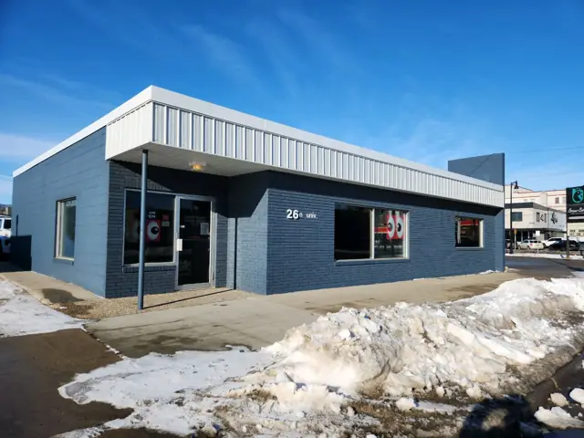A small retail building with display windows, a commercial building inspected by Nordic Inspections in Fargo, ND.