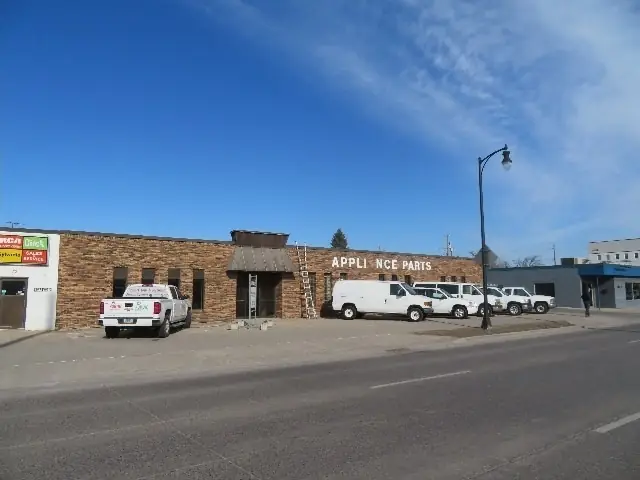 A small retail building with display windows — commercial building inspected by Nordic Inspections in Fargo, ND.