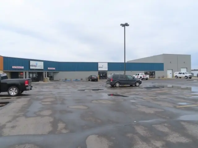 A retail center with a large parking lot, a commercial building inspected by Nordic Inspections in Fargo, ND.