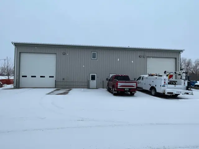 A shop building with a paved apron — commercial building inspected by Nordic Inspections in Fargo, ND.