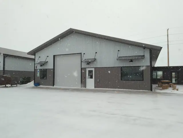A metal shop building with overhead doors — commercial building inspected by Nordic Inspections in Fargo, ND.