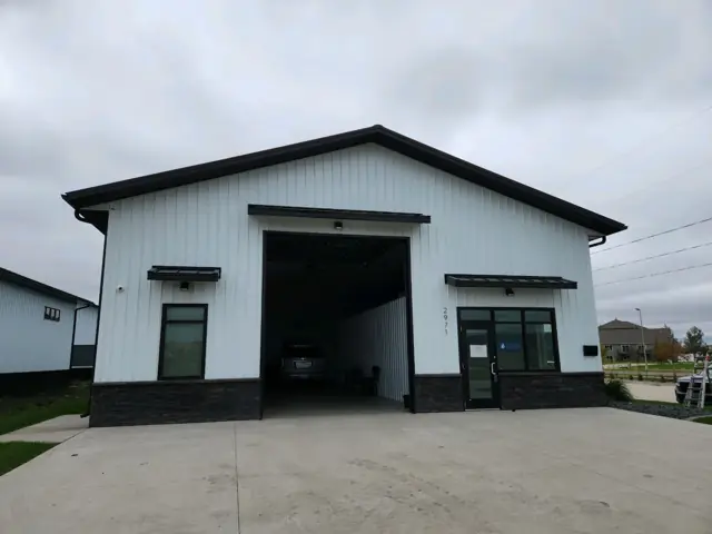 A metal shop building with overhead doors, a commercial building inspected by Nordic Inspections in Fargo, ND.