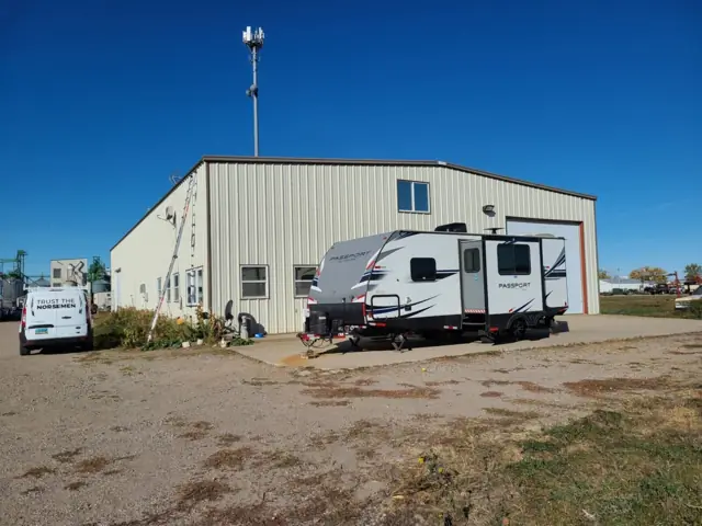 A metal shop building with overhead doors, a commercial building inspected by Nordic Inspections in Fargo, ND.
