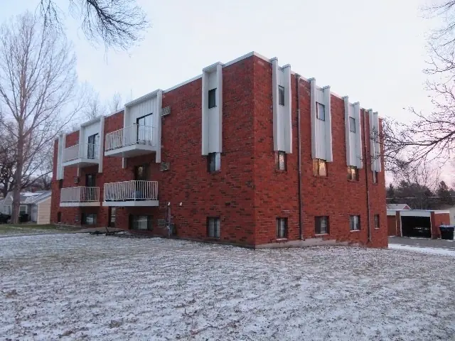 A multi-story brick apartment building, a commercial building inspected by Nordic Inspections in Fergus Falls, MN.