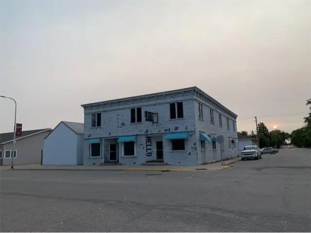 A mixed-use building with storefronts and upper floors, a commercial building inspected by Nordic Inspections in Fertile, MN.