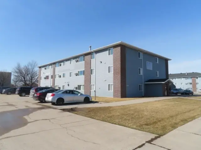 A walk-up apartment building with a shared entrance — commercial building inspected by Nordic Inspections in Grand Forks, ND.