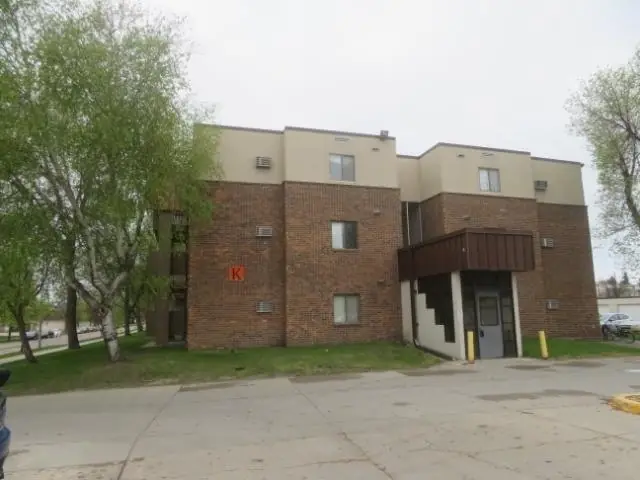 A multi-story brick apartment building, a commercial building inspected by Nordic Inspections in Grand Forks, ND.