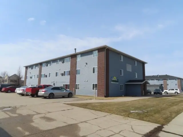 A multi-story brick apartment building, a commercial building inspected by Nordic Inspections in Grand Forks, ND.
