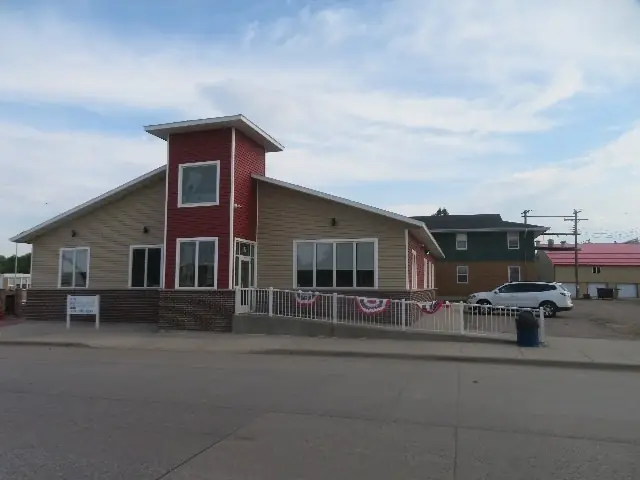 A single-story office building with a front parking lot — commercial building inspected by Nordic Inspections in Halstad, MN.