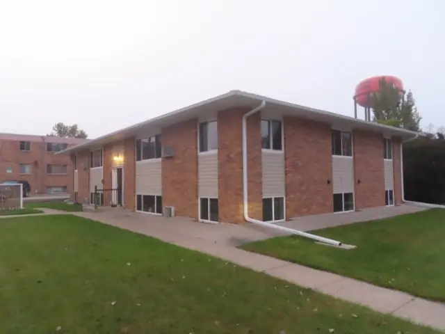 A multi-story brick apartment building — commercial building inspected by Nordic Inspections in Jamestown, ND.
