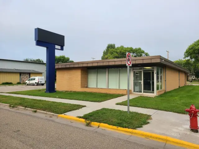 An office building with a landscaped entrance — commercial building inspected by Nordic Inspections in Lisbon, ND.