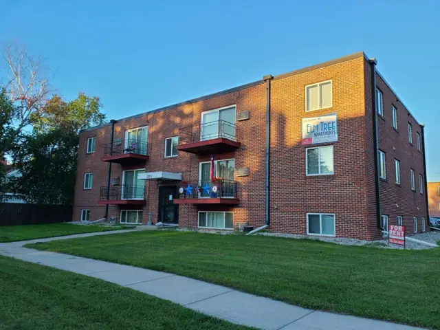 A walk-up apartment building with a shared entrance — commercial building inspected by Nordic Inspections in Mayville, ND.