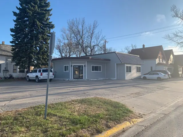 An office building with a landscaped entrance — commercial building inspected by Nordic Inspections in Mayville, ND.