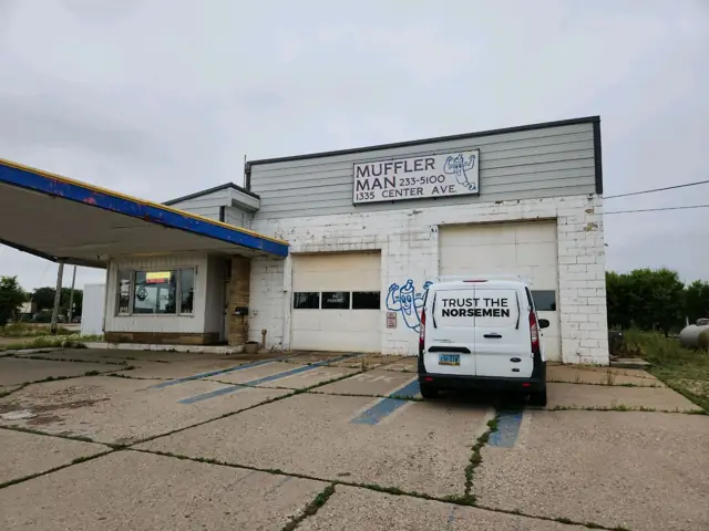 An automotive service building with service bays, a commercial building inspected by Nordic Inspections in Moorhead, MN.