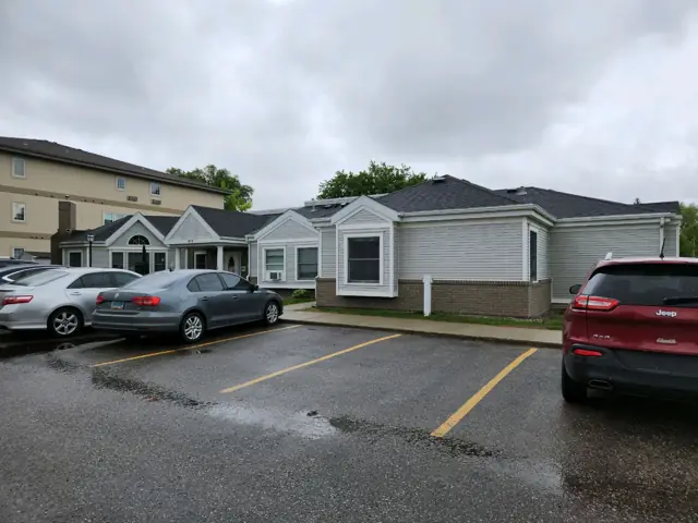 An office building with a landscaped entrance — commercial building inspected by Nordic Inspections in Moorhead, MN.