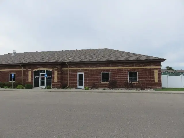 A single-story office building with a front parking lot, a commercial building inspected by Nordic Inspections in Moorhead, MN.